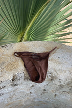 Load image into Gallery viewer, Light brown bikini bottoms made with recycled fabric.
