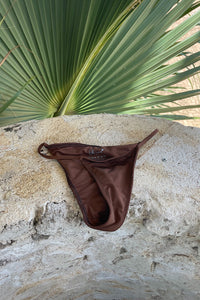 Light brown bikini bottoms made with recycled fabric.