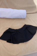 Load image into Gallery viewer, Black mini swim skirt by Elle&#39;s Swim.
