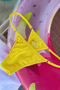 Yellow bikini bottoms perfect for summer.